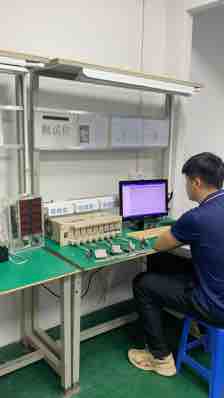 TUODI employee working at a connected switch test bench